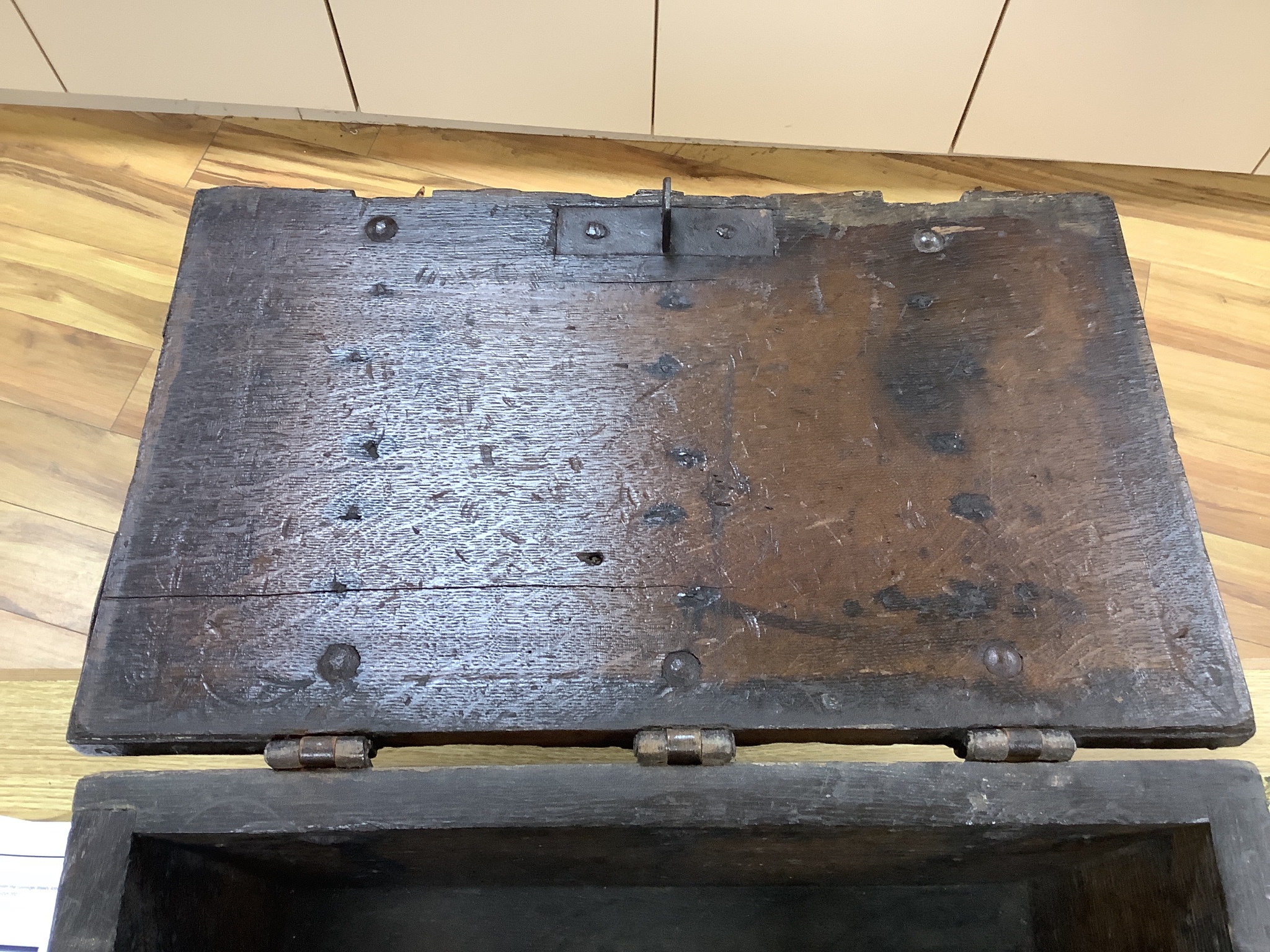 A 17th/18th century iron bound oak strong box, 60cm wide, 36cm deep, 35.5cm high